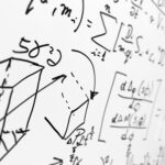 Complex math formulas on whiteboard. Mathematics and science with economics